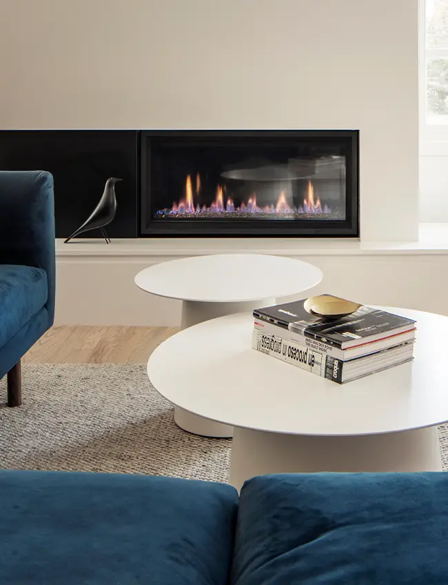 book on table on modern living room, Modern fireplace in background